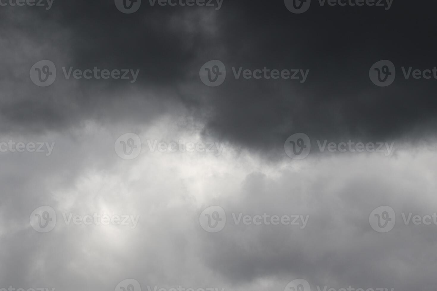 Cloudscape scenery, overcast weather above dark blue sky. Storm clouds floating in a rainy dull day with natural light. White and grey scenic environment background. Nature view. photo