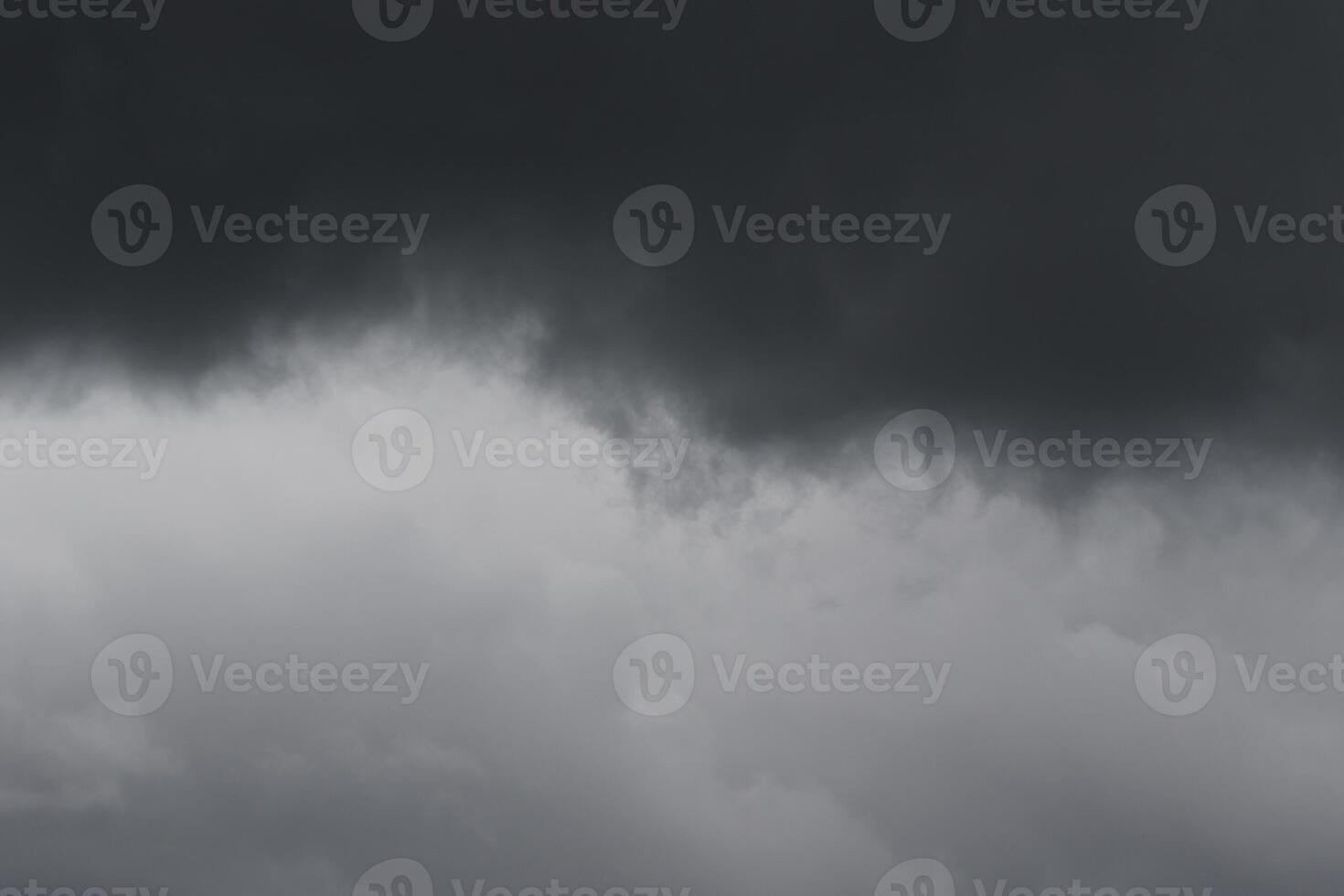 Cloudscape scenery, overcast weather above dark blue sky. Storm clouds floating in a rainy dull day with natural light. White and grey scenic environment background. Nature view. photo