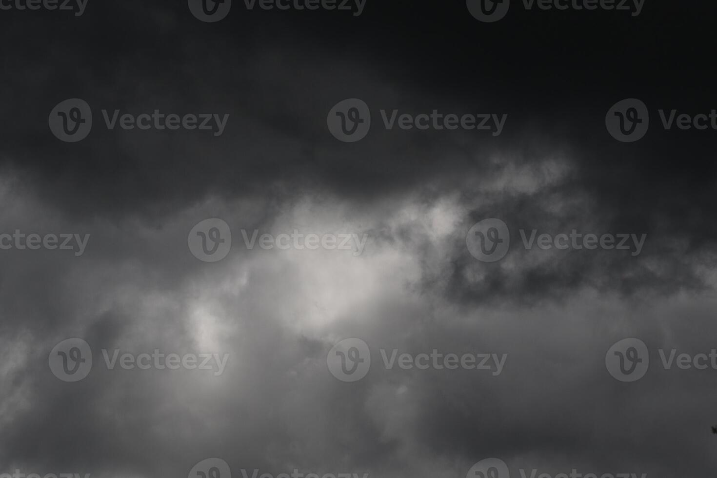 Cloudscape scenery, overcast weather above dark blue sky. Storm clouds floating in a rainy dull day with natural light. White and grey scenic environment background. Nature view. photo