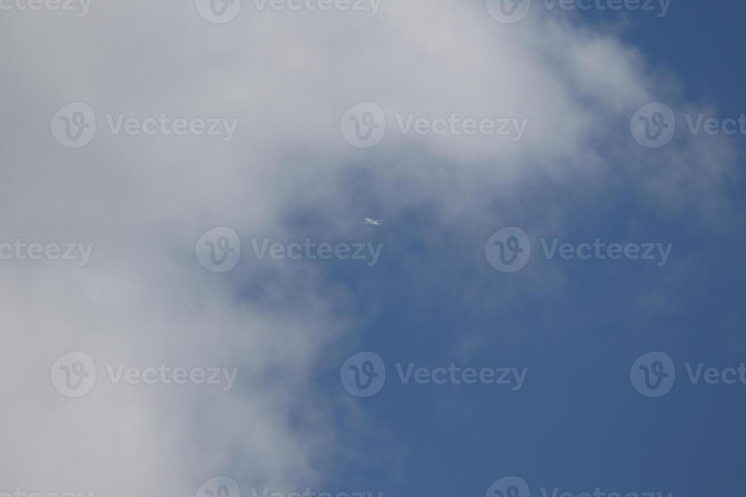 Cloudscape scenery, overcast weather above dark blue sky. Storm clouds floating in a rainy dull day with natural light. White and grey scenic environment background. Nature view. photo