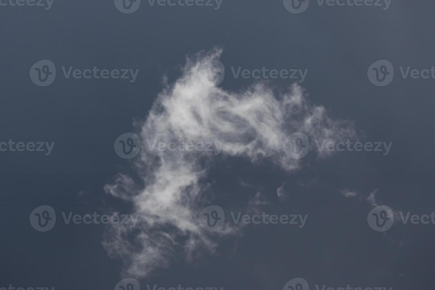 Cloudscape scenery, overcast weather above dark blue sky. Storm clouds floating in a rainy dull day with natural light. White and grey scenic environment background. Nature view. photo