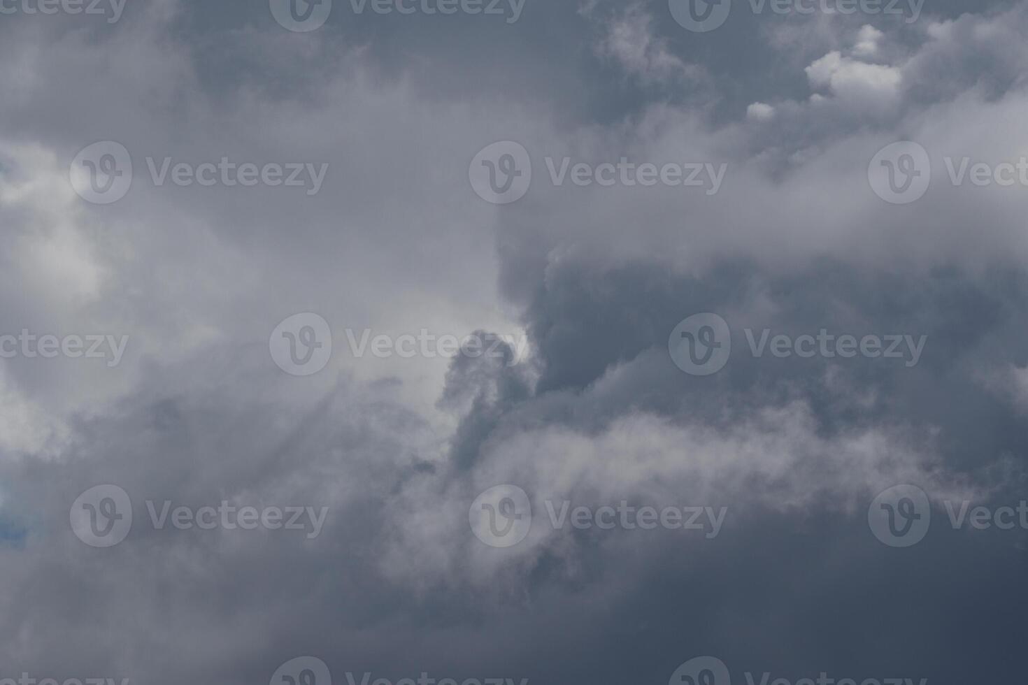Cloudscape scenery, overcast weather above dark blue sky. Storm clouds floating in a rainy dull day with natural light. White and grey scenic environment background. Nature view. photo