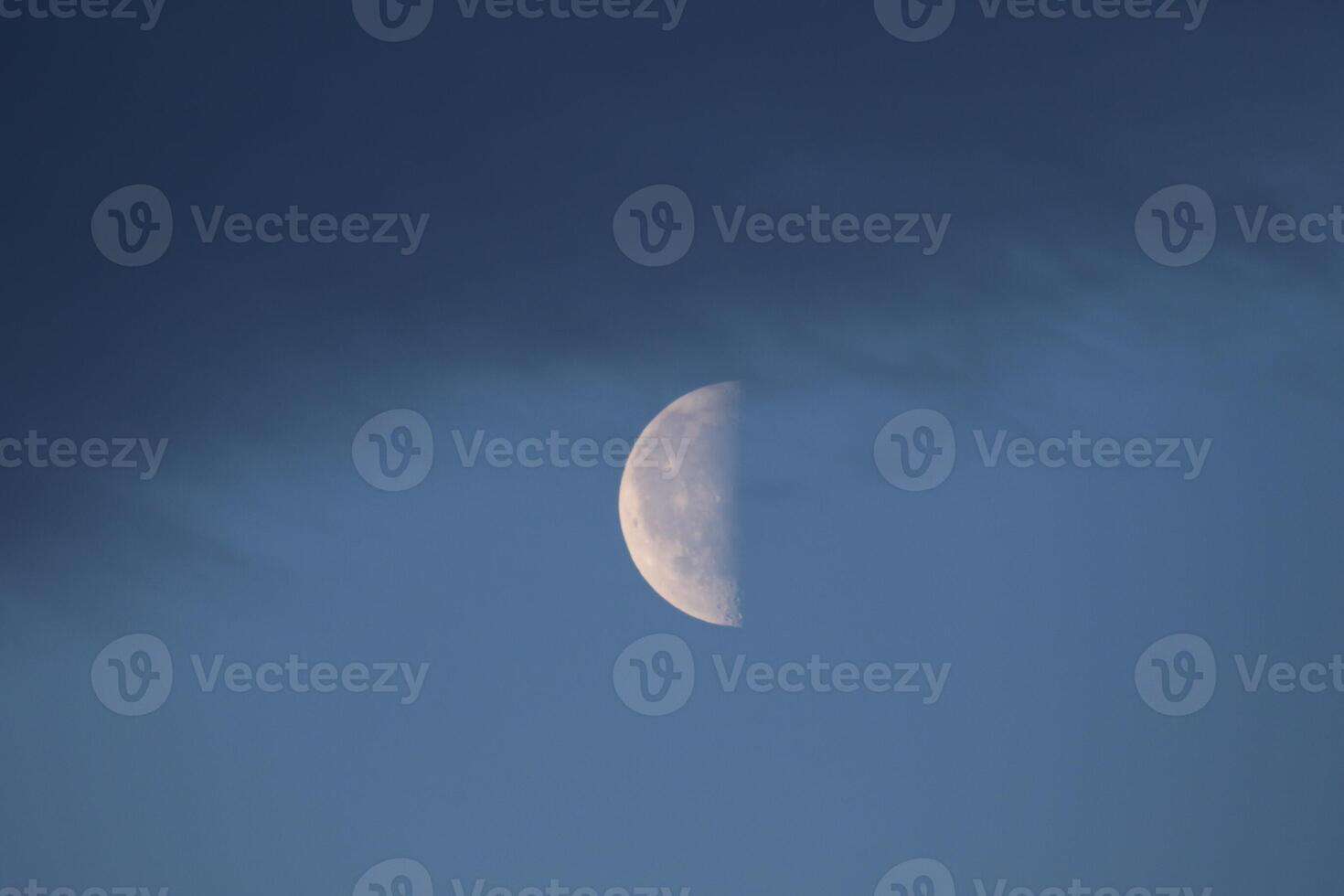 The colorful blue soft sky above the clouds with half moon photo