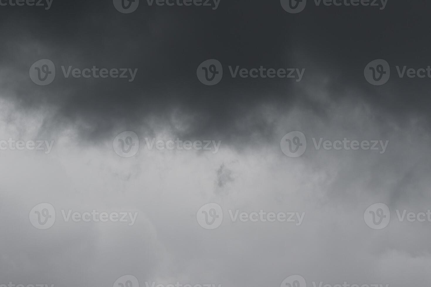 Cloudscape scenery, overcast weather above dark blue sky. Storm clouds floating in a rainy dull day with natural light. White and grey scenic environment background. Nature view. photo