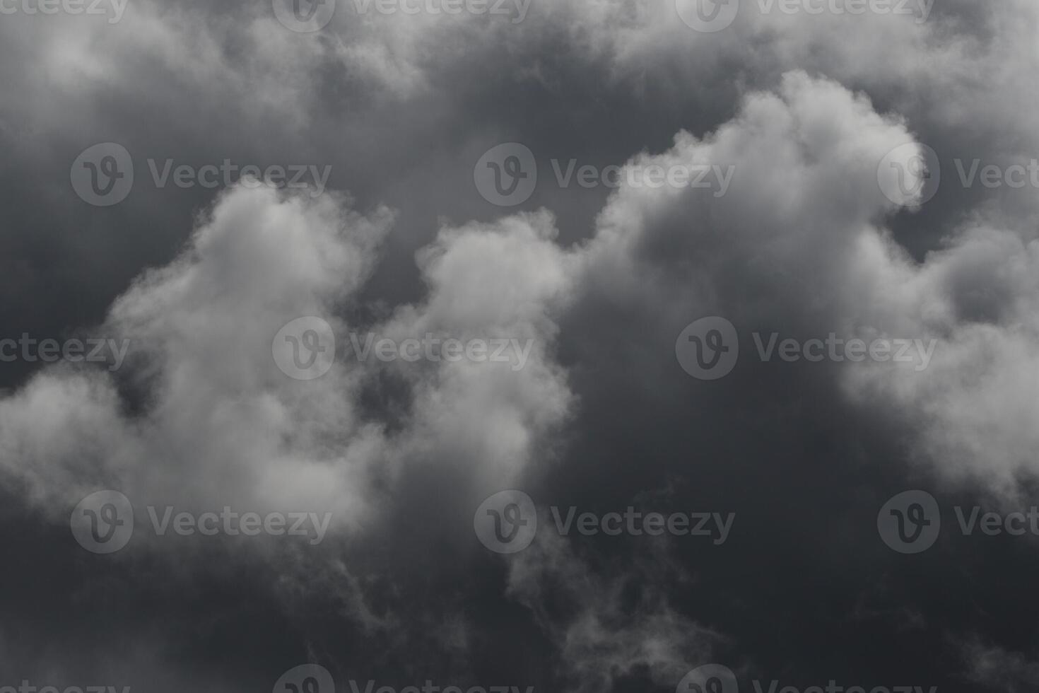 Cloudscape scenery, overcast weather above dark blue sky. Storm clouds floating in a rainy dull day with natural light. White and grey scenic environment background. Nature view. photo