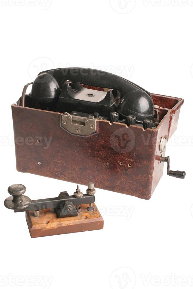 An old army phone isolated on a white background with cliping path. photo