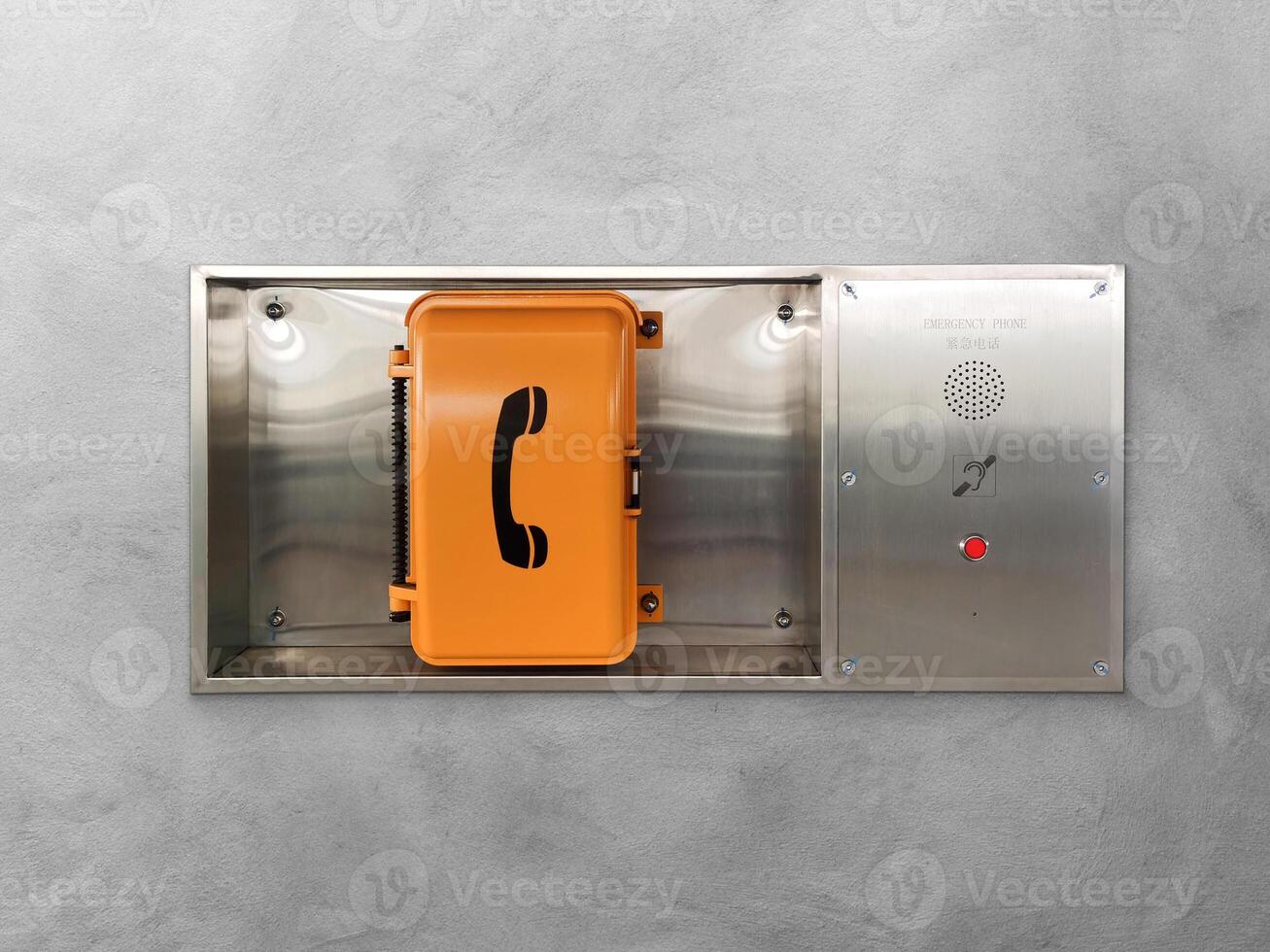 Emergency telephone on a cement wall photo