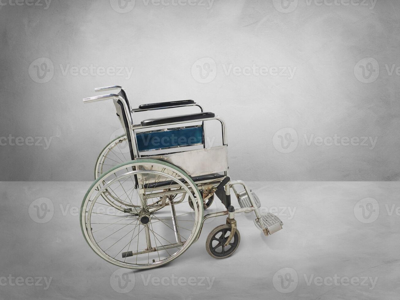 Empty wheelchair in an empty room photo