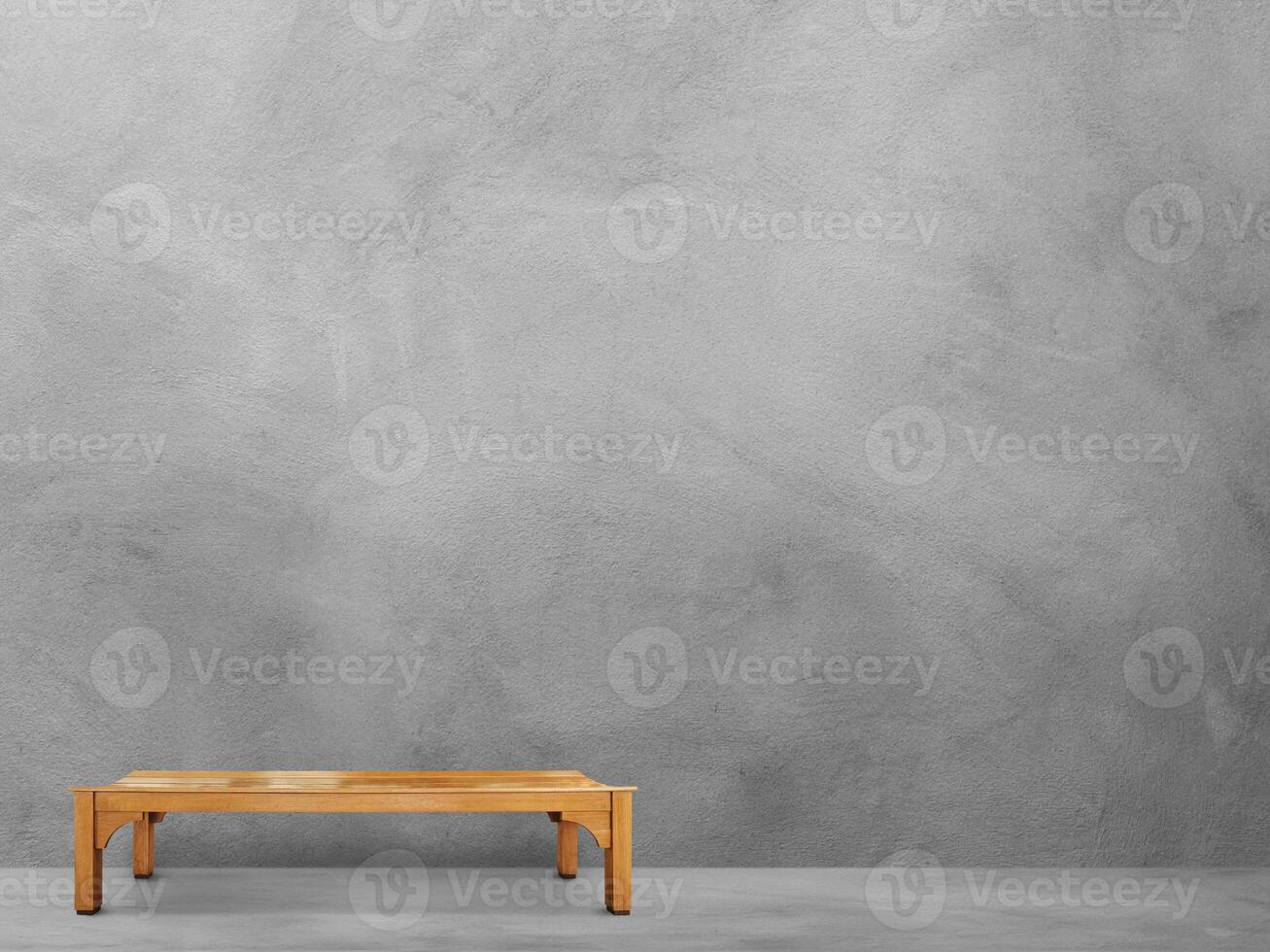 Long wooden chair in the cement room photo