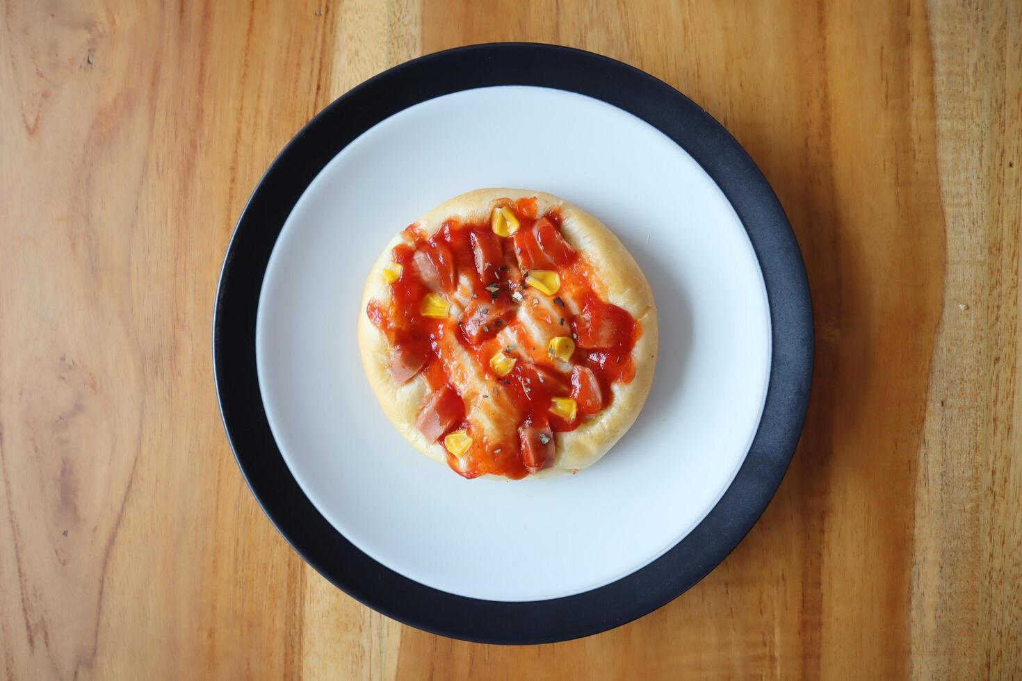 A plate of beef sausage bread on the table photo