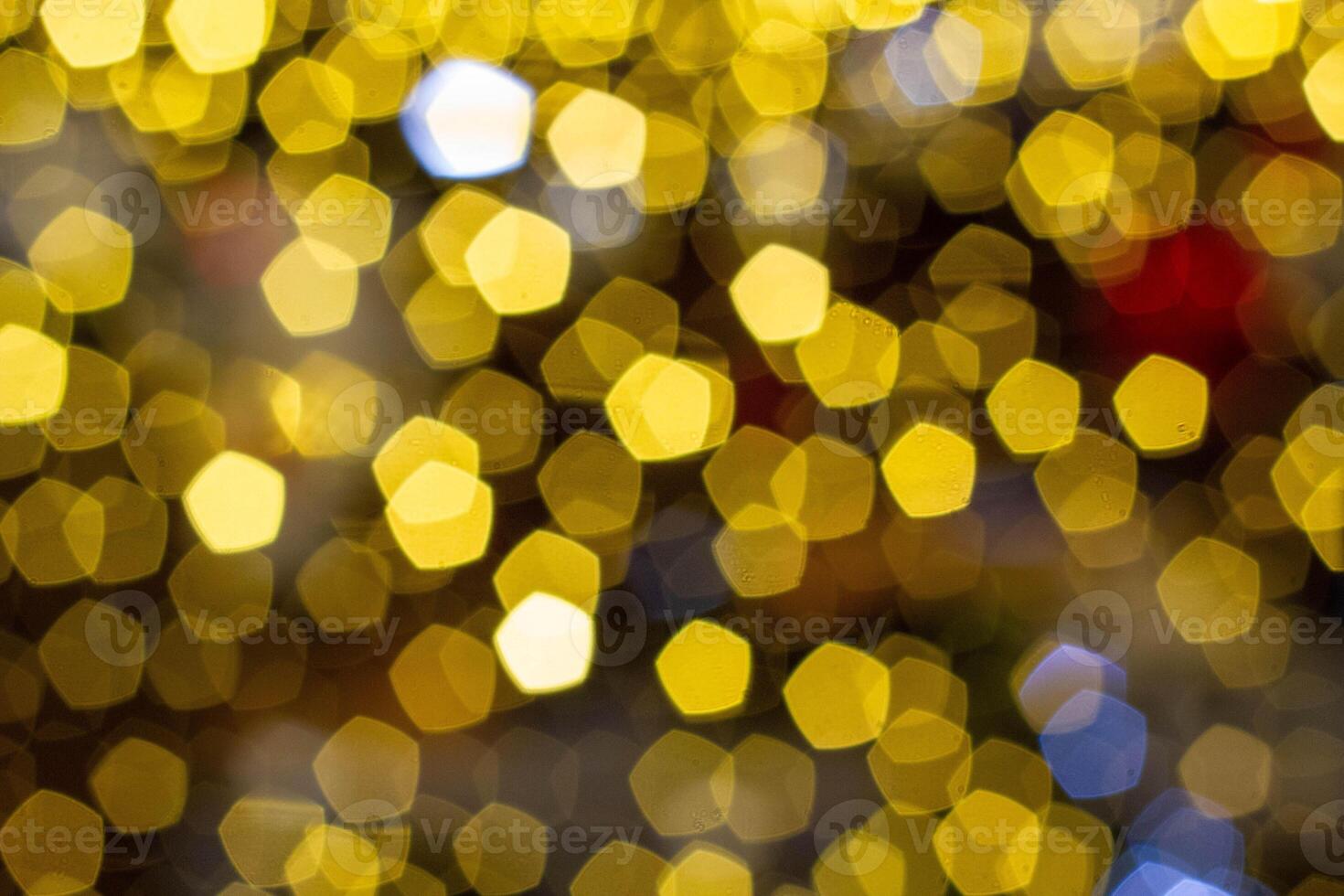 Yellow pentagon bokeh in the dark. photo