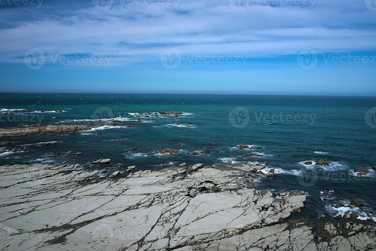 Ocean shore in Kaikoura, New Zealand photo