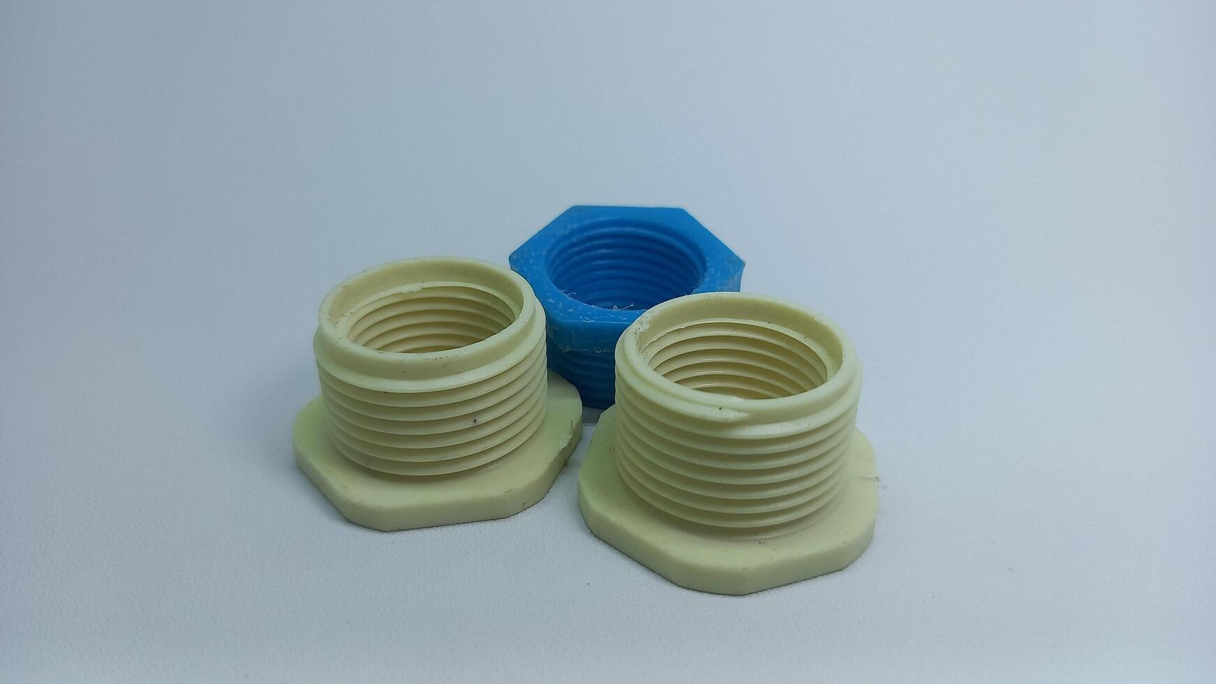two plastic nuts and a blue one photo