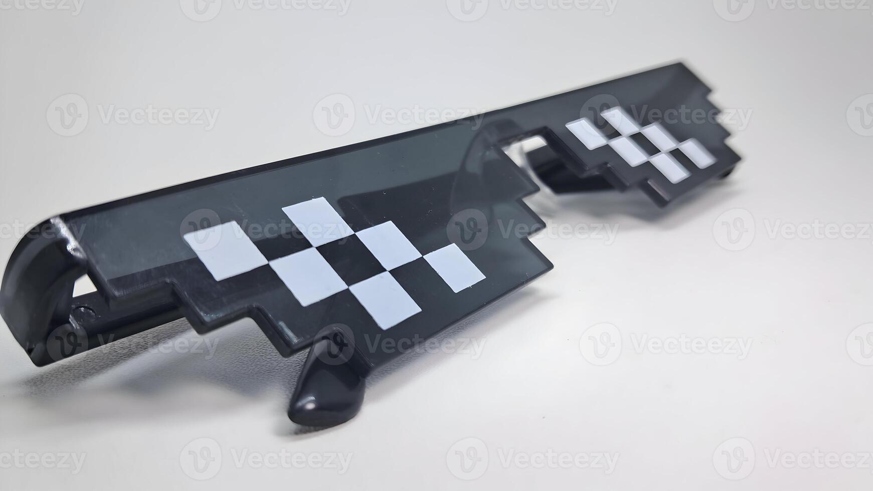 close up of glasses with pixel design photo