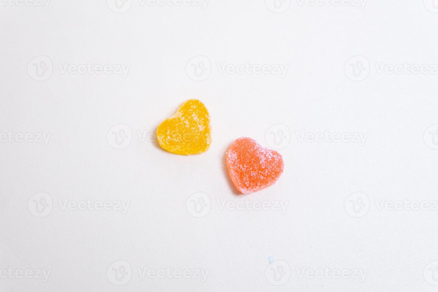 Heart shaped Candy and multi colored candy on Isolated on White Background. photo