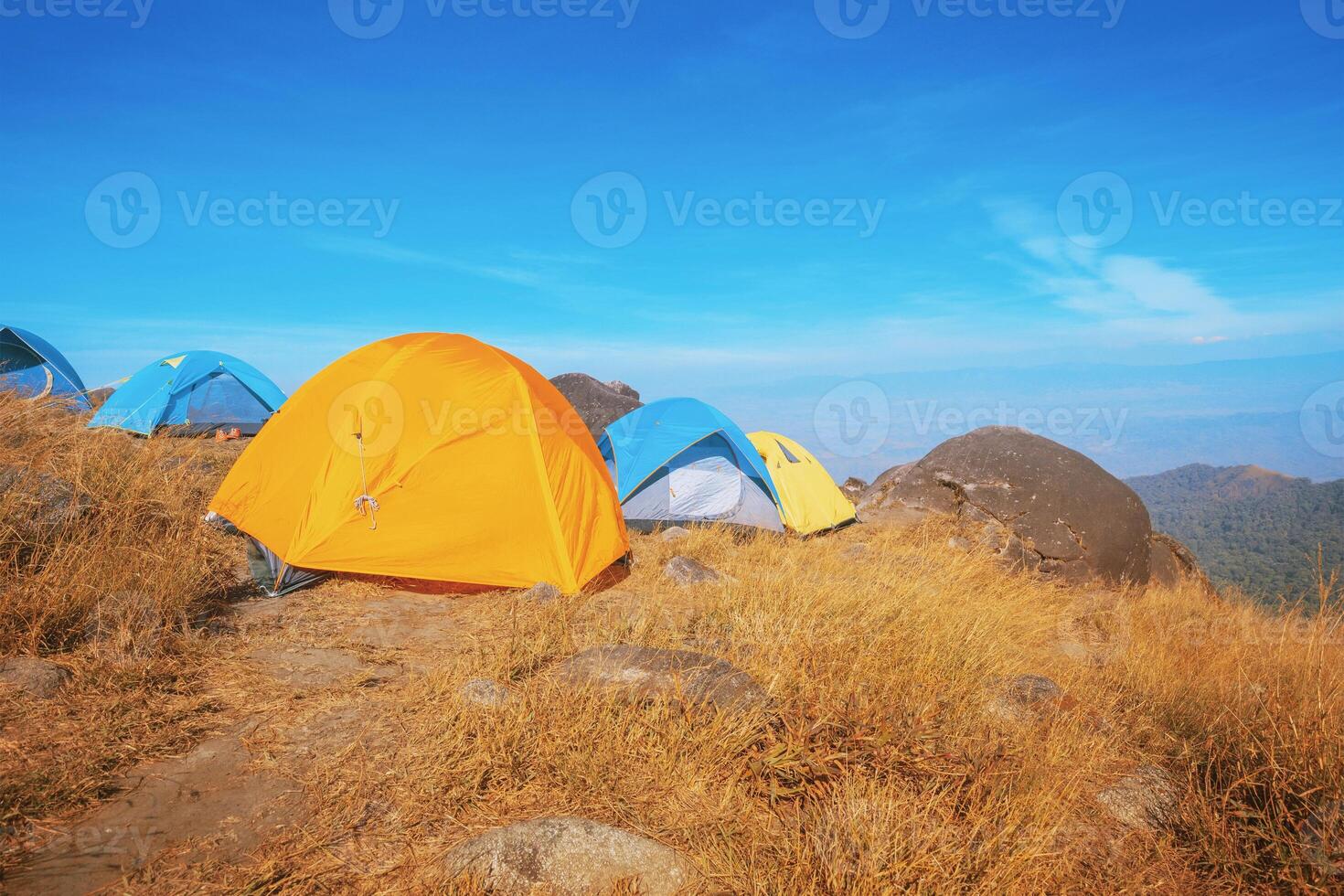 Set up a tent on the hill Full of grasslands photo