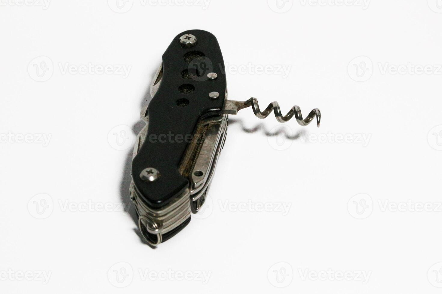 Pocket knife. Steel arm. Multi tool kit. A small folding knife was tied. Multi tool for climbing. White background pocket folding knife photo