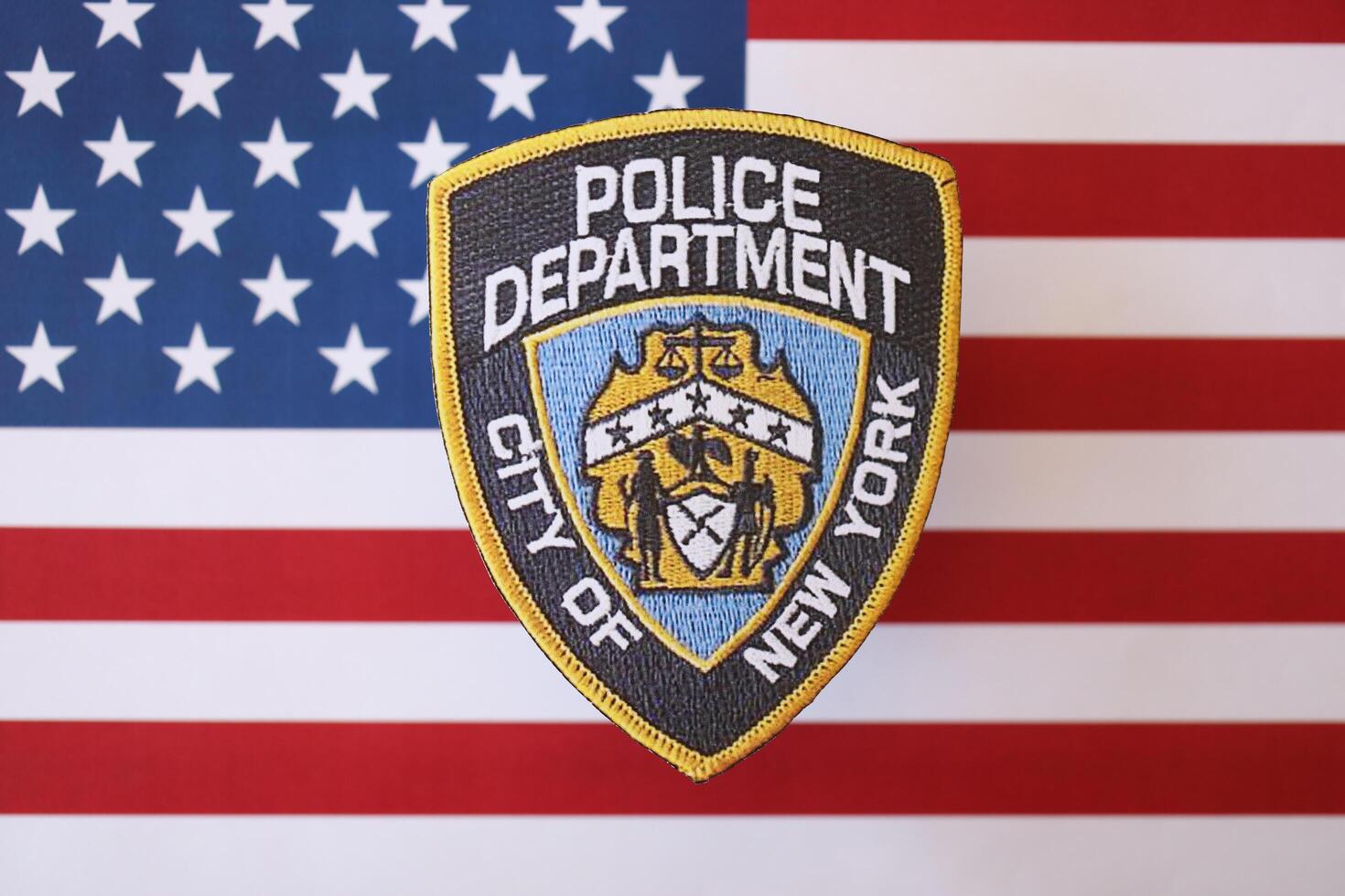 KYIV, UKRAINE - MARCH 9, 2024 US NYPD Police patch on United States of America flag photo