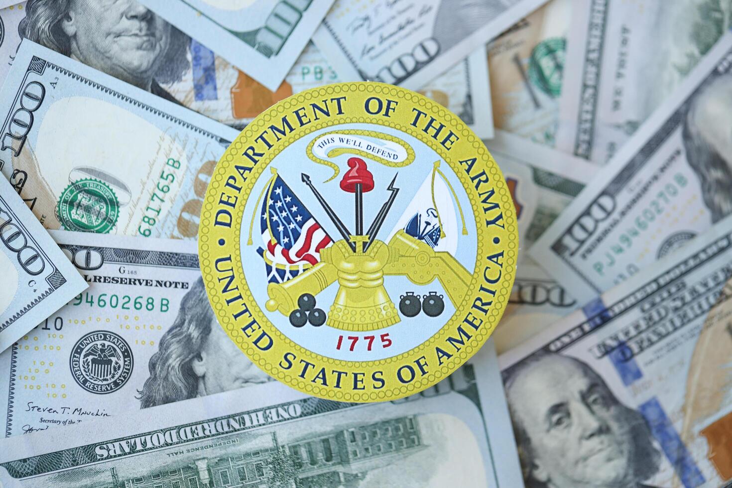 KYIV, UKRAINE - MARCH 9, 2024 US Department of Army seal on many US hundred dollar bills photo