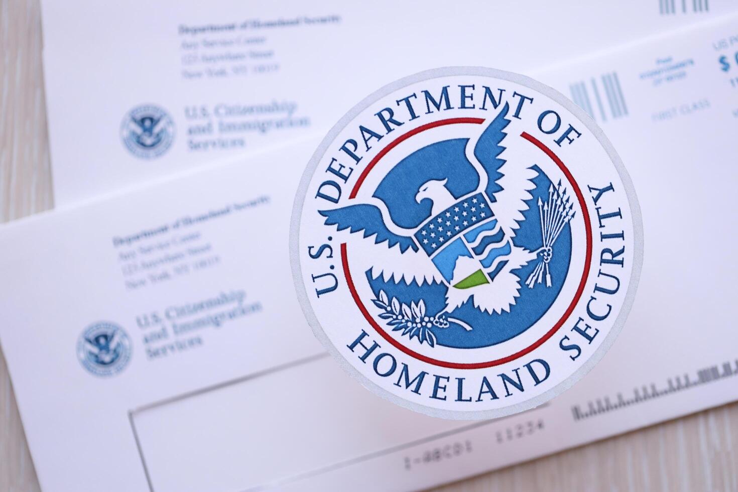 KYIV, UKRAINE - MARCH 9, 2024 US Department of Homeland Security seal on USCIS mail envelope photo