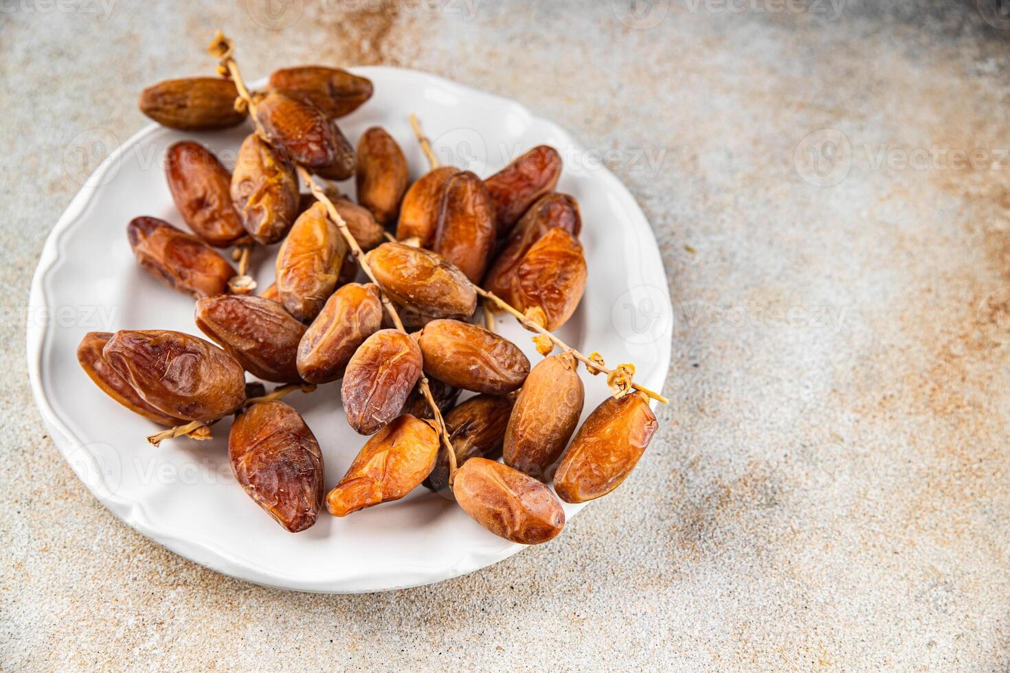date on a branch dried sweet fruit fresh appetizer meal food snack on the table copy space food background rustic top view photo