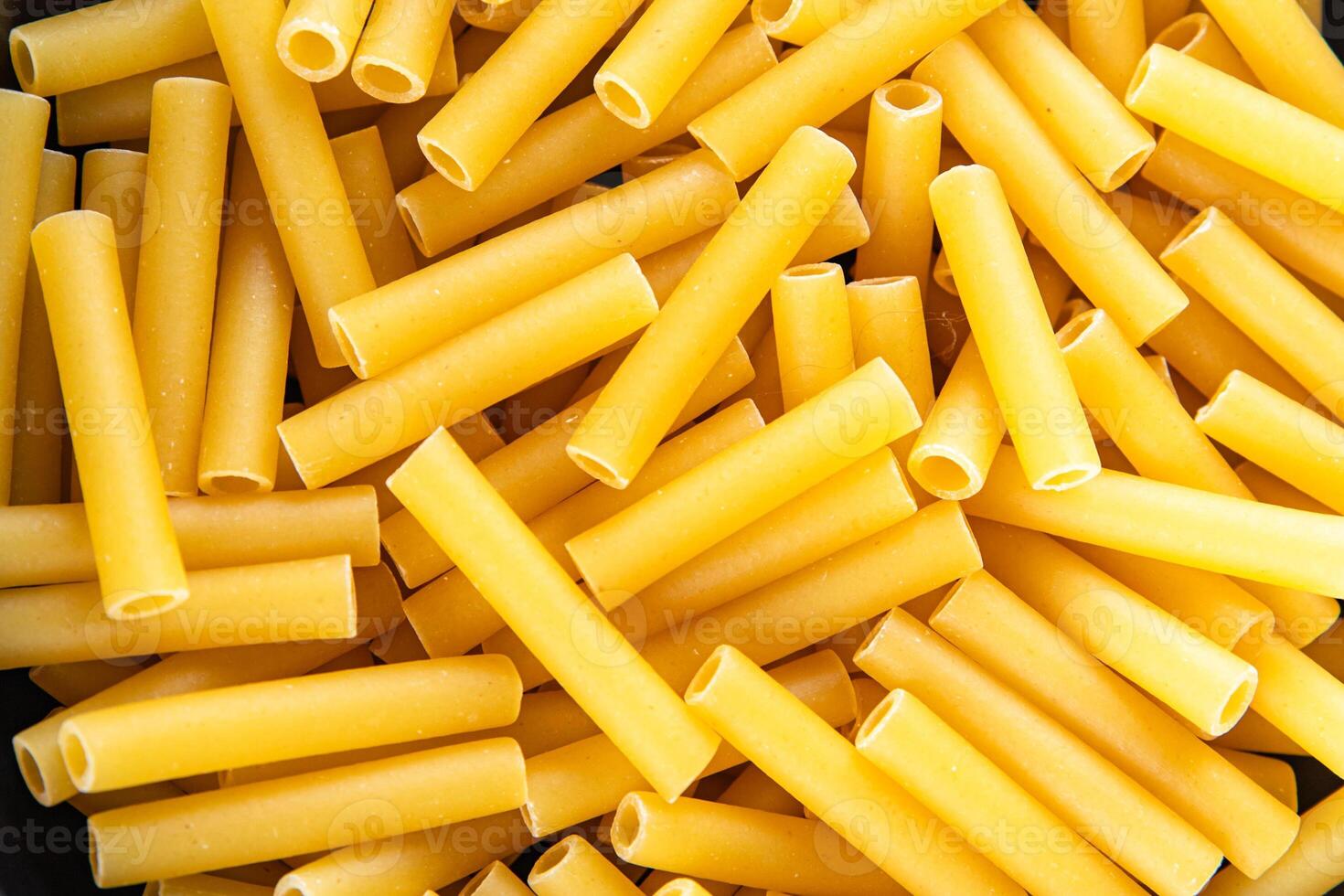 raw pasta tortiglioni cooking appetizer meal food snack on the table copy space food background photo