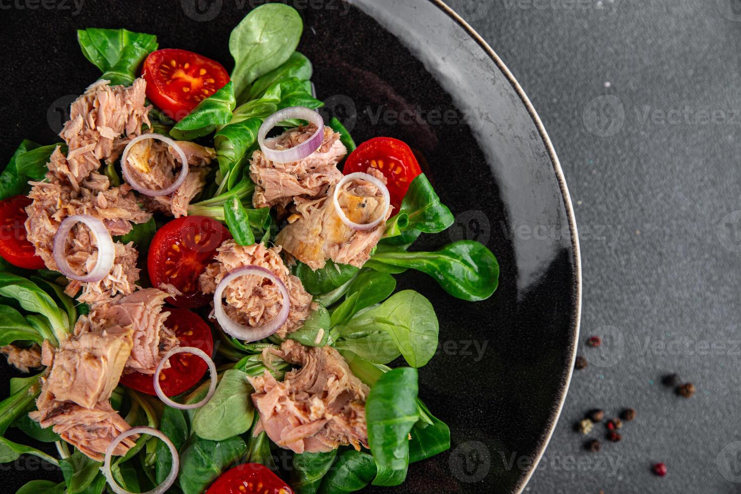 tuna salad, tomato, green leaf lettuce, onion healthy eating cooking appetizer meal food snack on the table copy space food background rustic top view photo