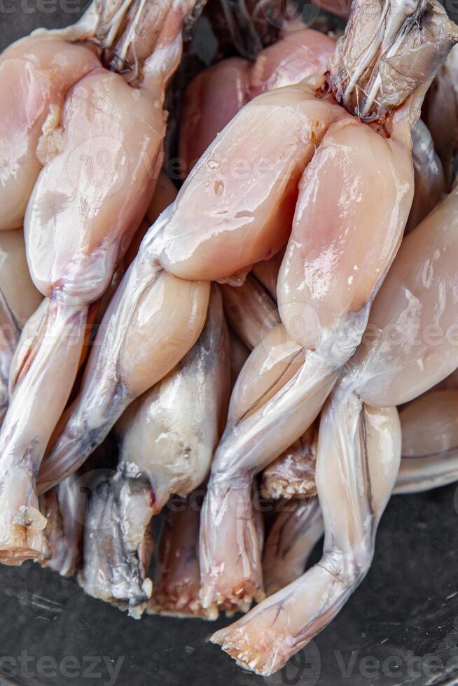 frog leg food raw meat fresh cooking meal food snack on the table copy space food background rustic top view photo