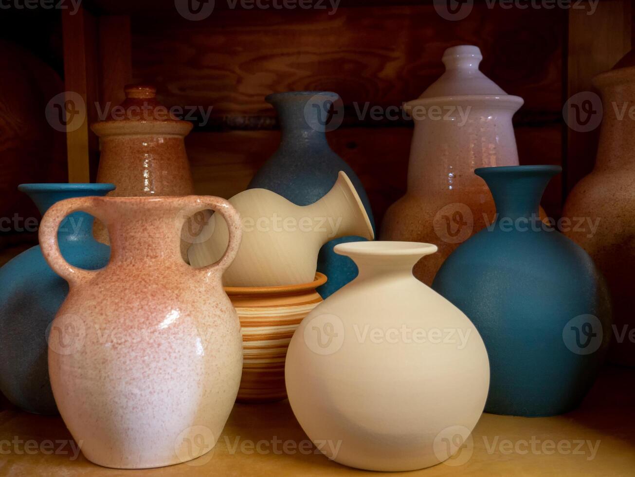 Clay jugs and pots, set of antique drinking utensils. pottery in the ceramics workshop. Pottery workshop, craft business photo