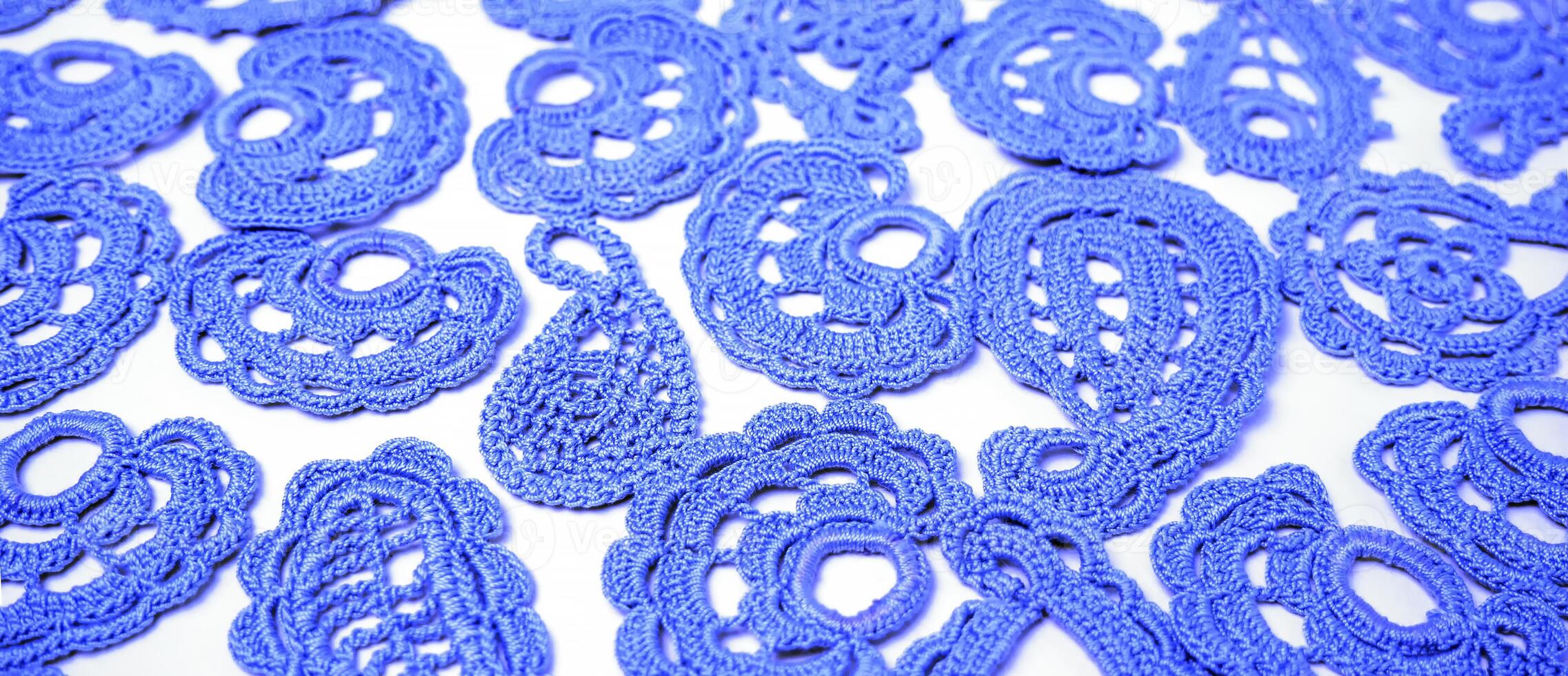 Old handmade lace pattern crocheted. Home hobby. Abstract background. Selected sharpness photo