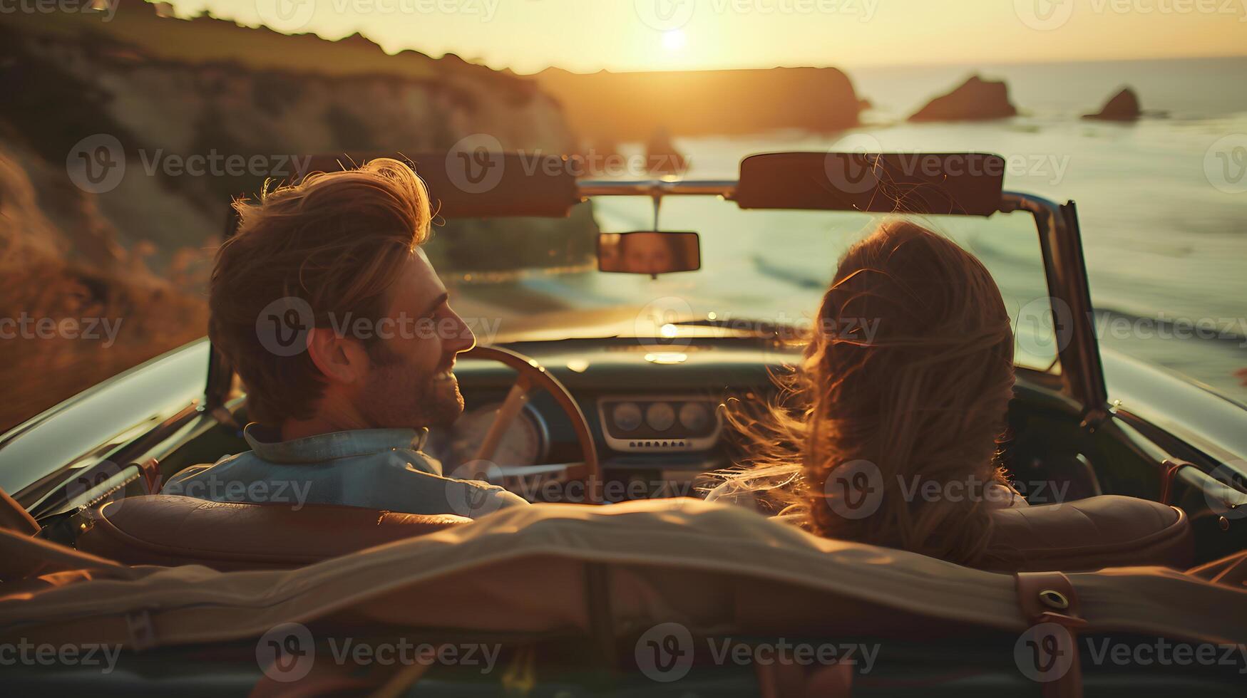 Couple in Convertible Admiring Ocean. photo