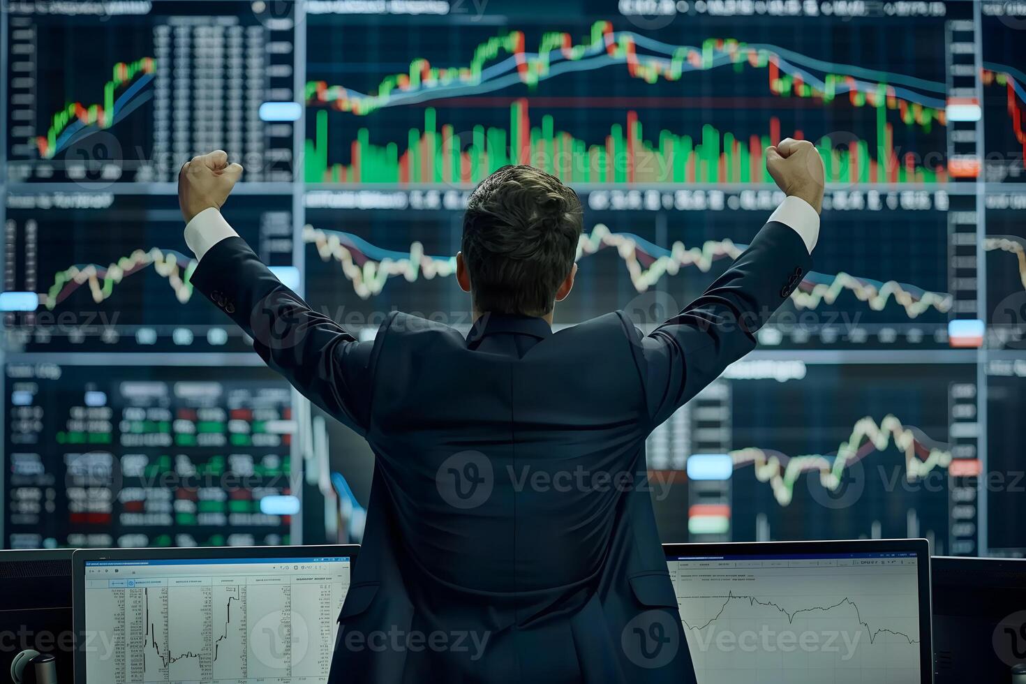 Back view of successful trader in front of stock market board photo