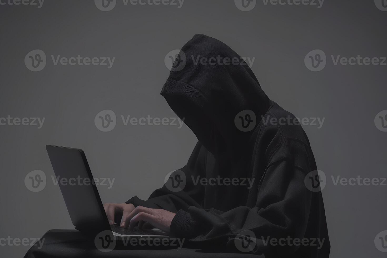 Anonymous hacker typing computer laptop. Cybercrime, cyberattack, dark web concept. photo