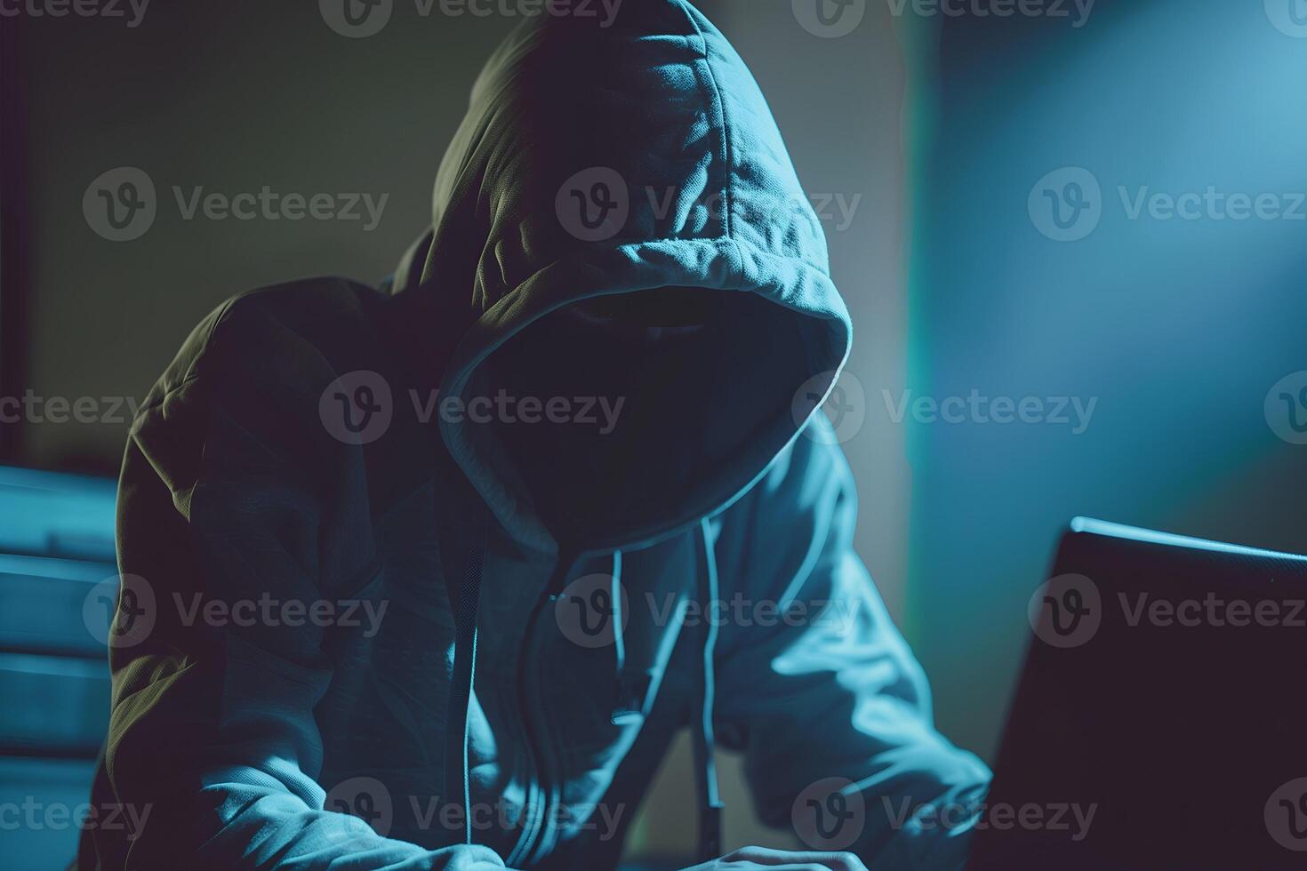 Anonymous hacker typing computer laptop. Cybercrime, cyberattack, dark web concept. photo