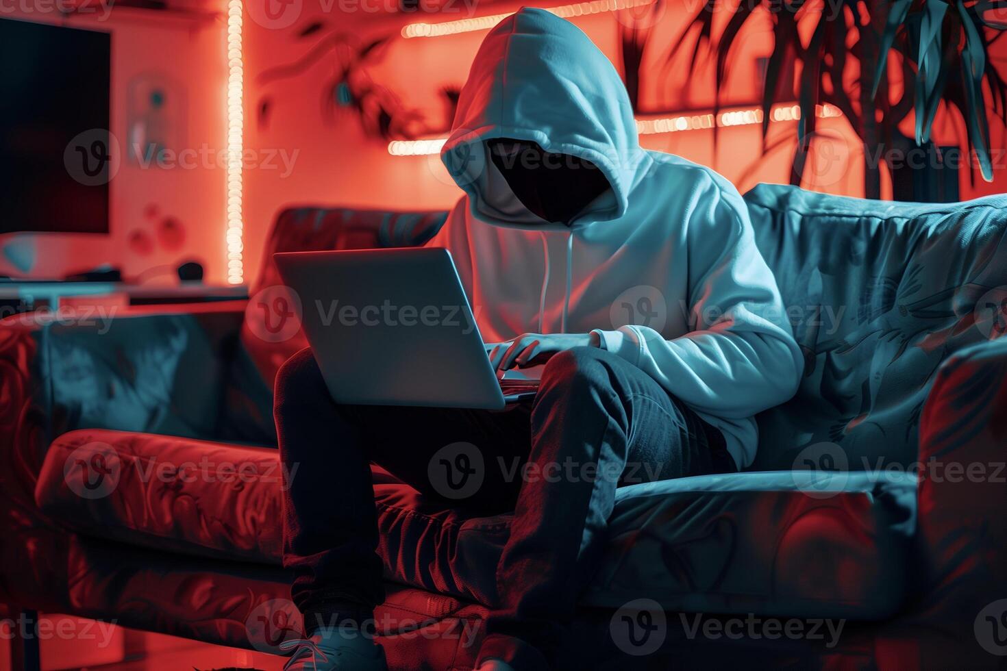 Fashionable anonymous hacker typing computer laptop. Cybercrime, cyberattack, dark web concept. photo
