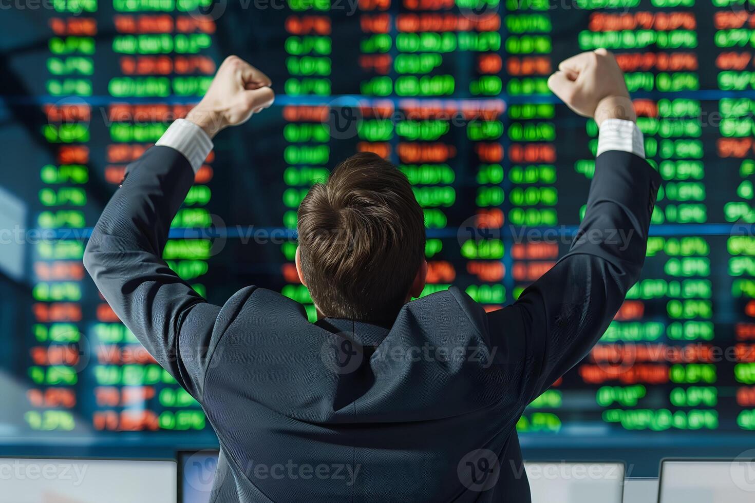 Back view of successful trader in front of stock market board photo