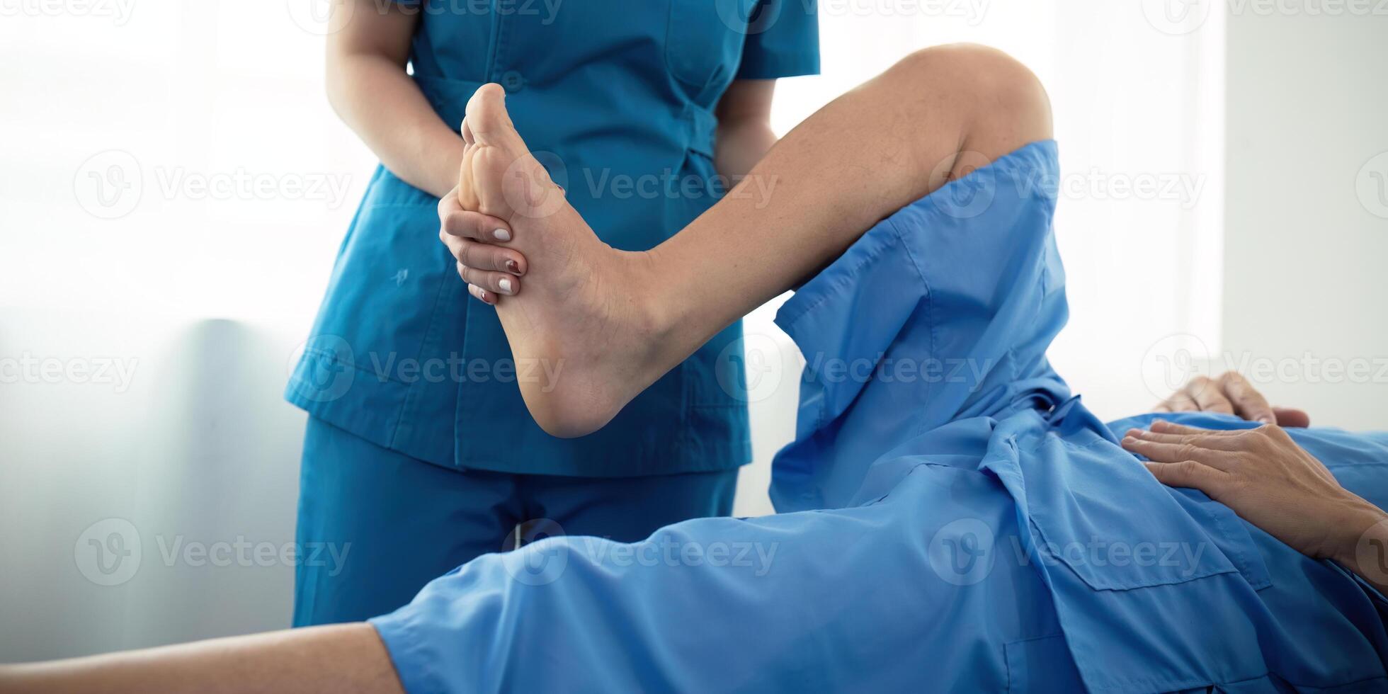 Healthcare, physiotherapist and patient with foot injury, stretching and recovery with treatment, healing or care. physical therapy or consultation photo