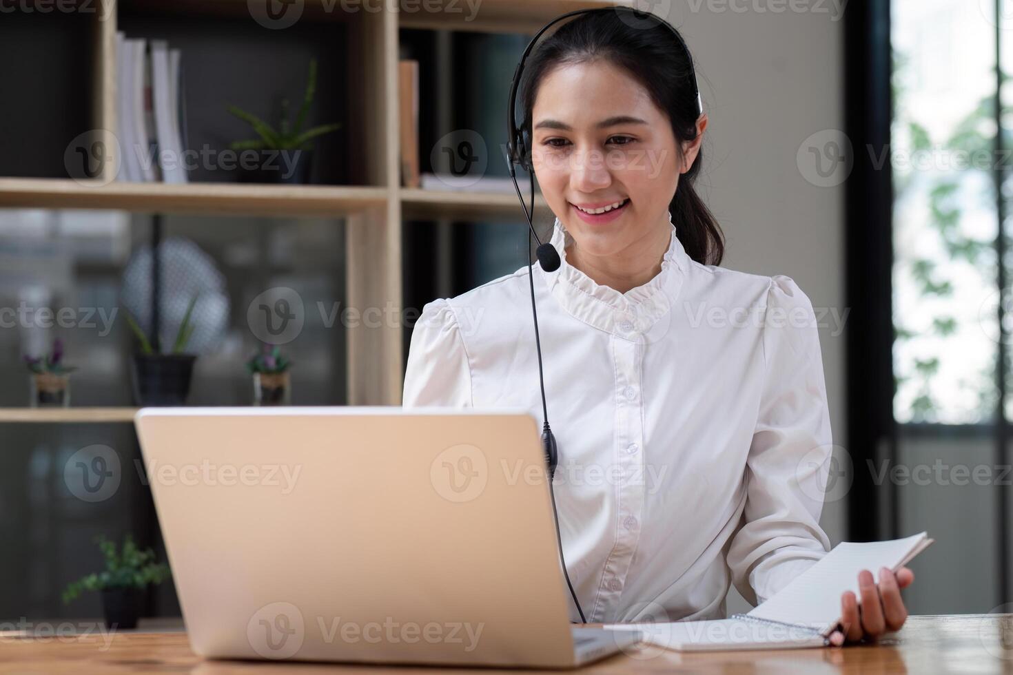 Call center agent with headset working on support hotline in office. conference. photo