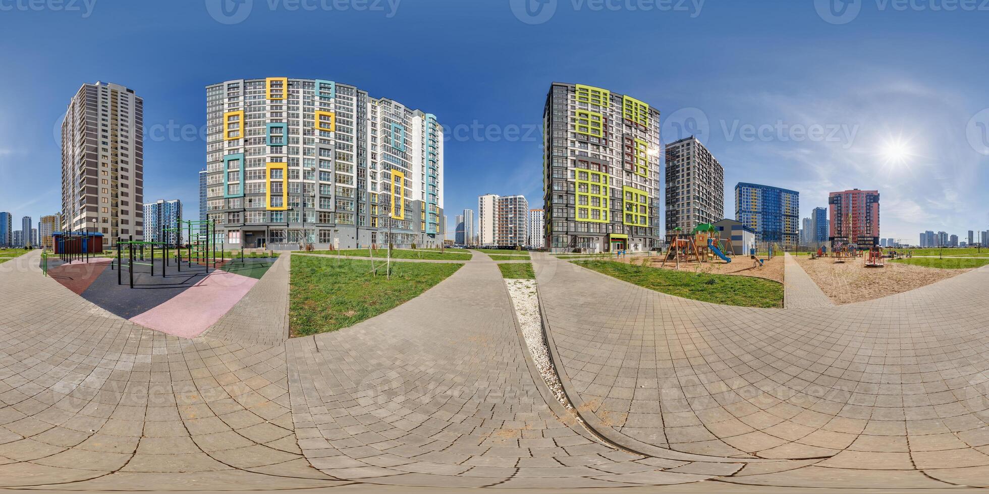 hdri panorama 360 near skyscraper multistory buildings of residential quarter complex with halo in sky in full equirectangular seamless spherical projection photo