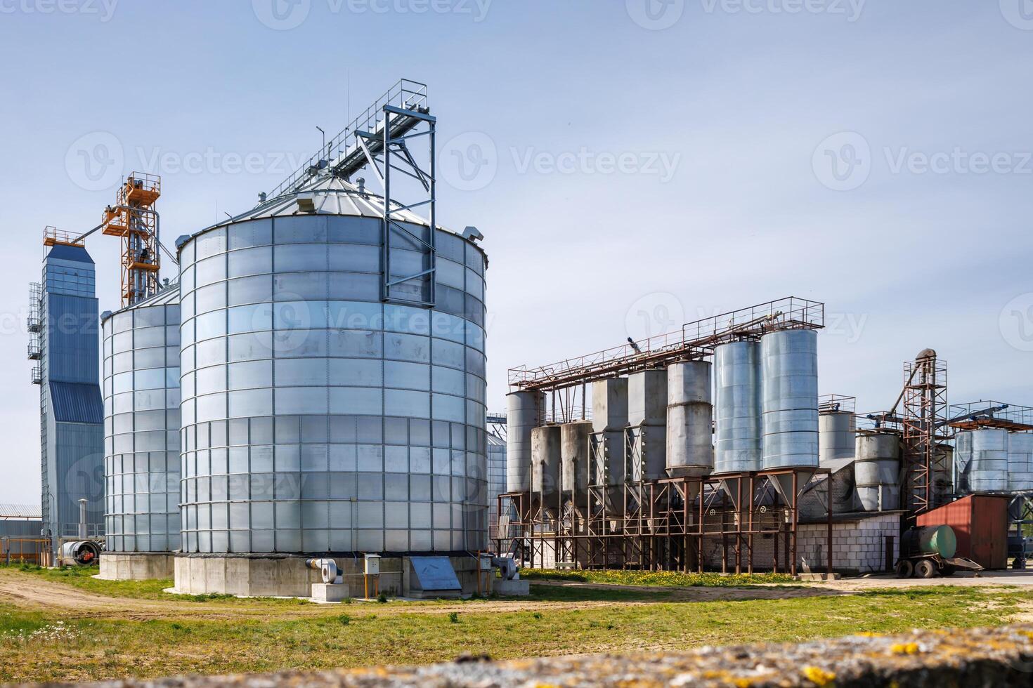 silos granary elevator on agro-industrial complex with seed cleaning and drying line for grain storage photo