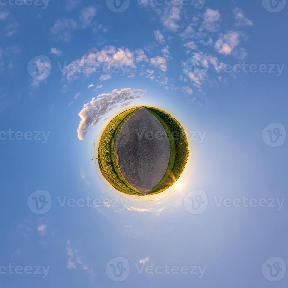 simple tiny planet without buildings in blue sky with beautiful clouds. Transformation of spherical panorama 360 degrees. Spherical abstract aerial view. Curvature of space. photo