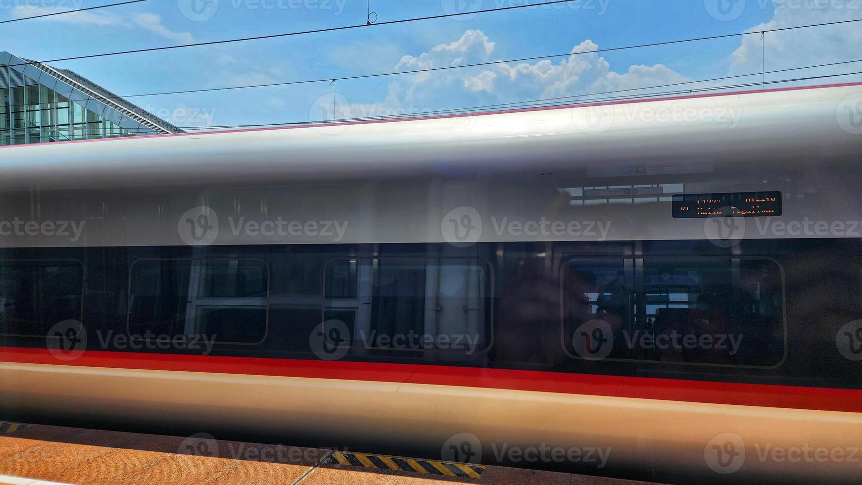 Modern high speed passenger train on the platform of the railway station. photo
