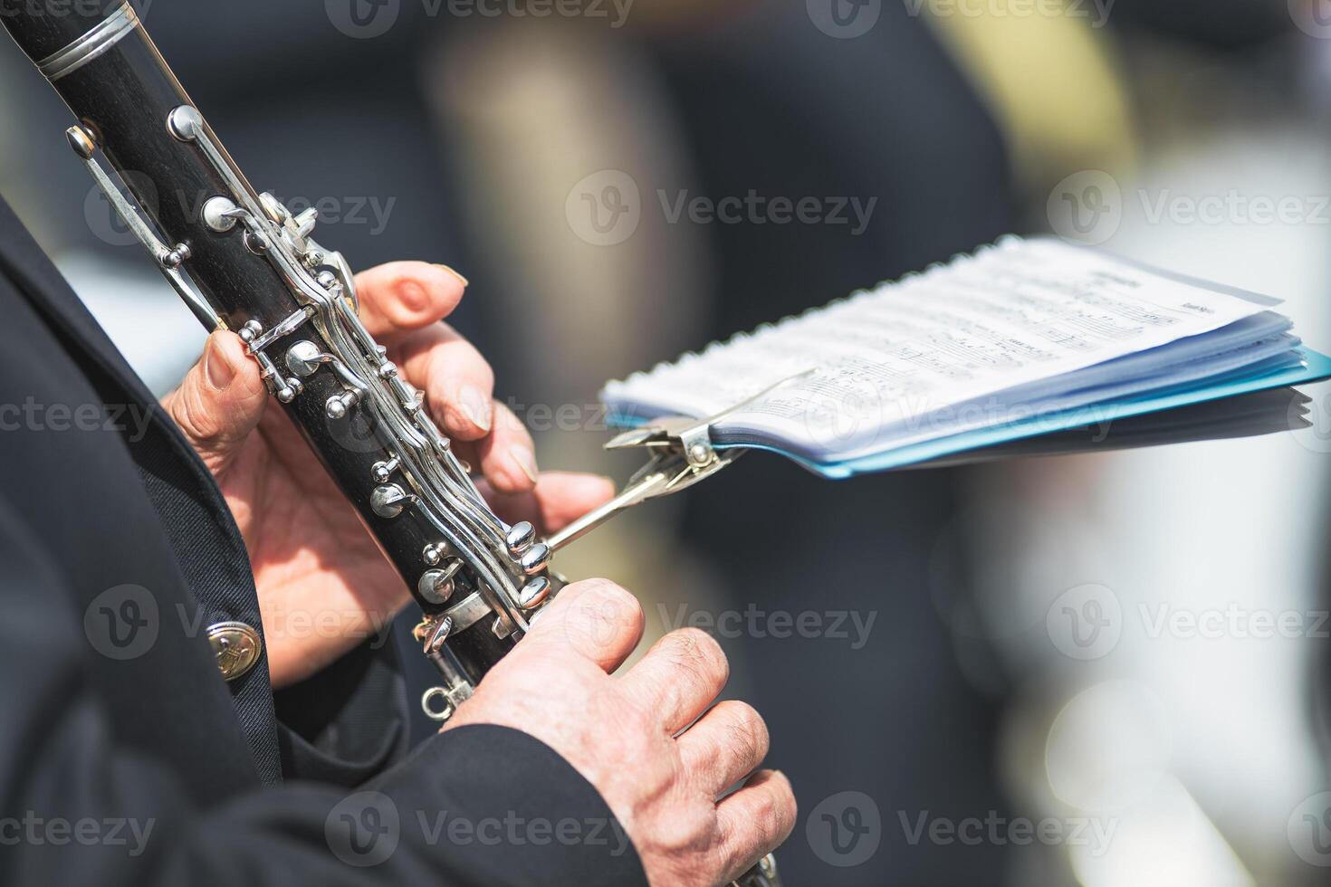 Details of hands playing the clarinet photo