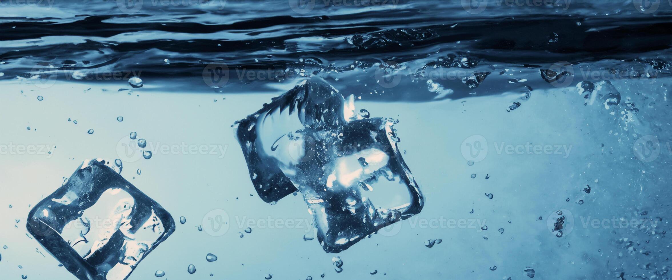 Water splashing and ice cube. Ice splashing into a glass of water. Underwater pouring ice cubes falling into clear watering background. Refreshing chill drinking. Ices in a glass with blue background photo