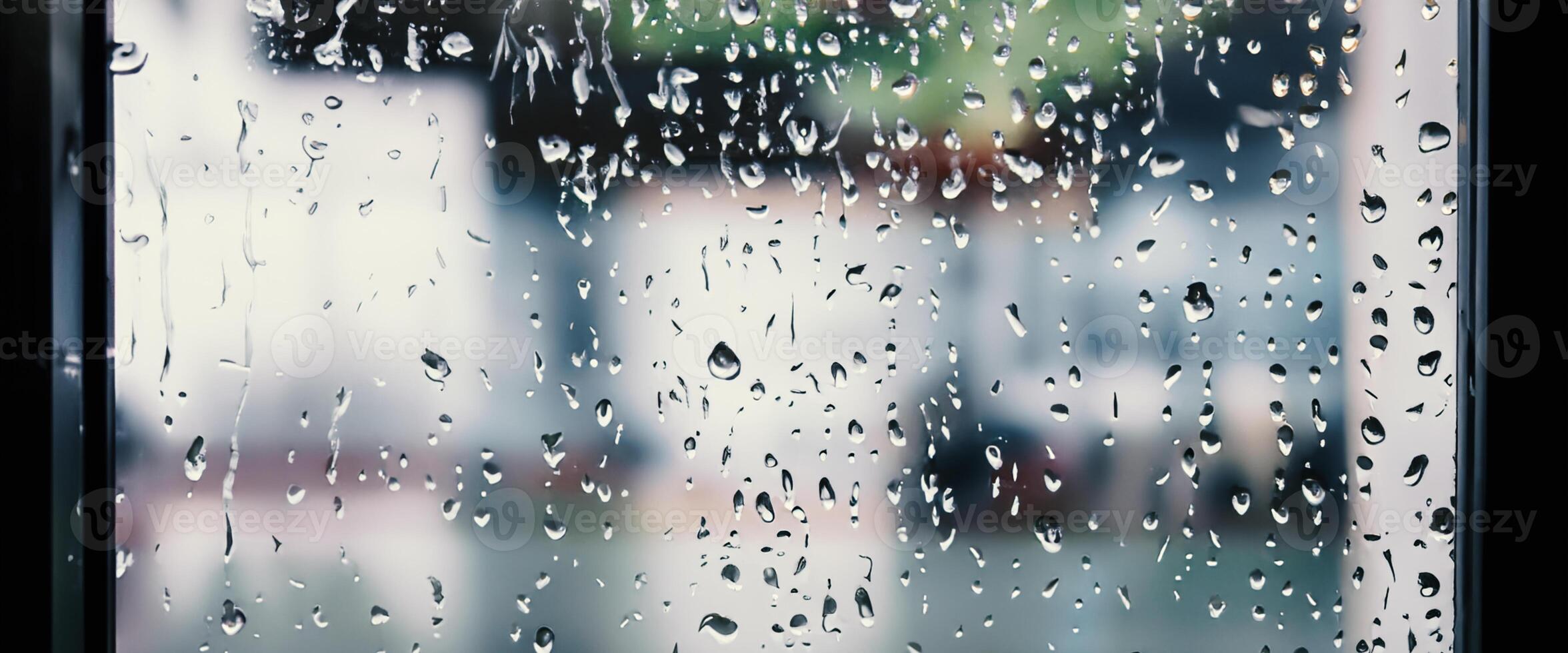 Rain drop on window glass of coffee shop and blurry city life background. Rainy season and blurry people city day life or bokeh night lights outside window. Coffee shop window covered with rain water photo
