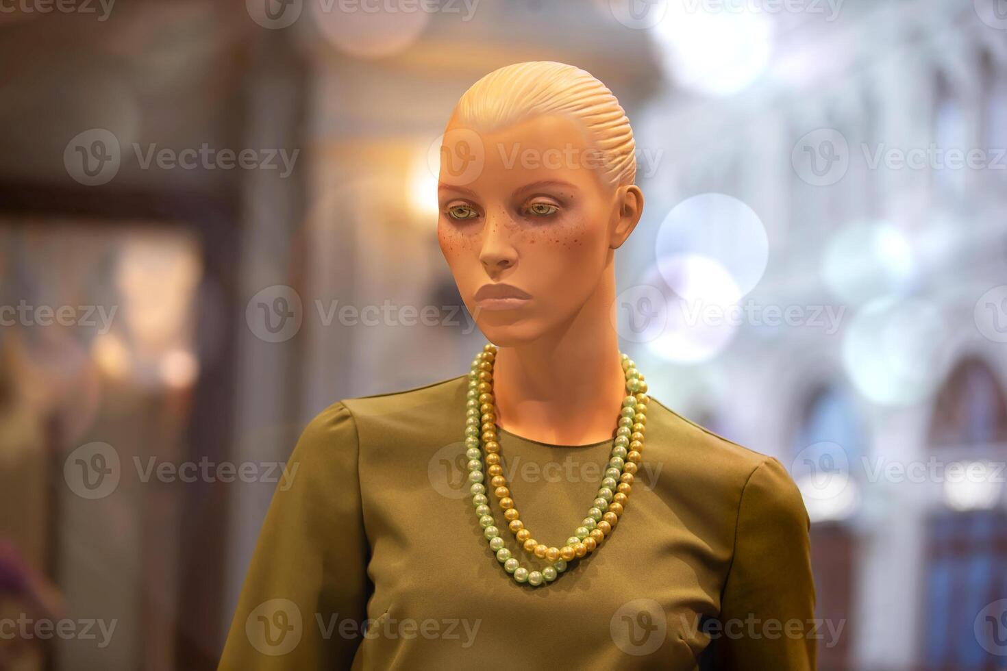 Female mannequin in a modest dress in the style of the seventies of the last century. photo