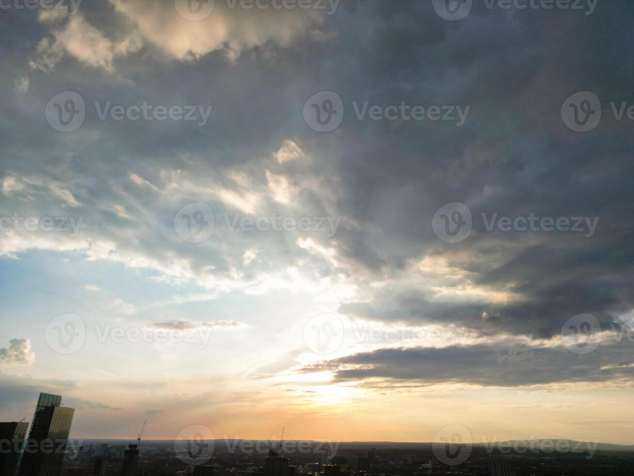 Aerial View of Greater Manchester City Centre and Tall Buildings During Golden Hour of Sunset. England UK. May 5th, 2024 photo