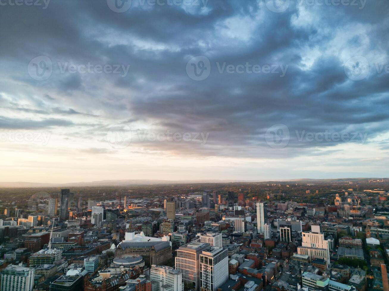 Aerial View of Greater Manchester City Centre and Tall Buildings During Golden Hour of Sunset. England UK. May 5th, 2024 photo
