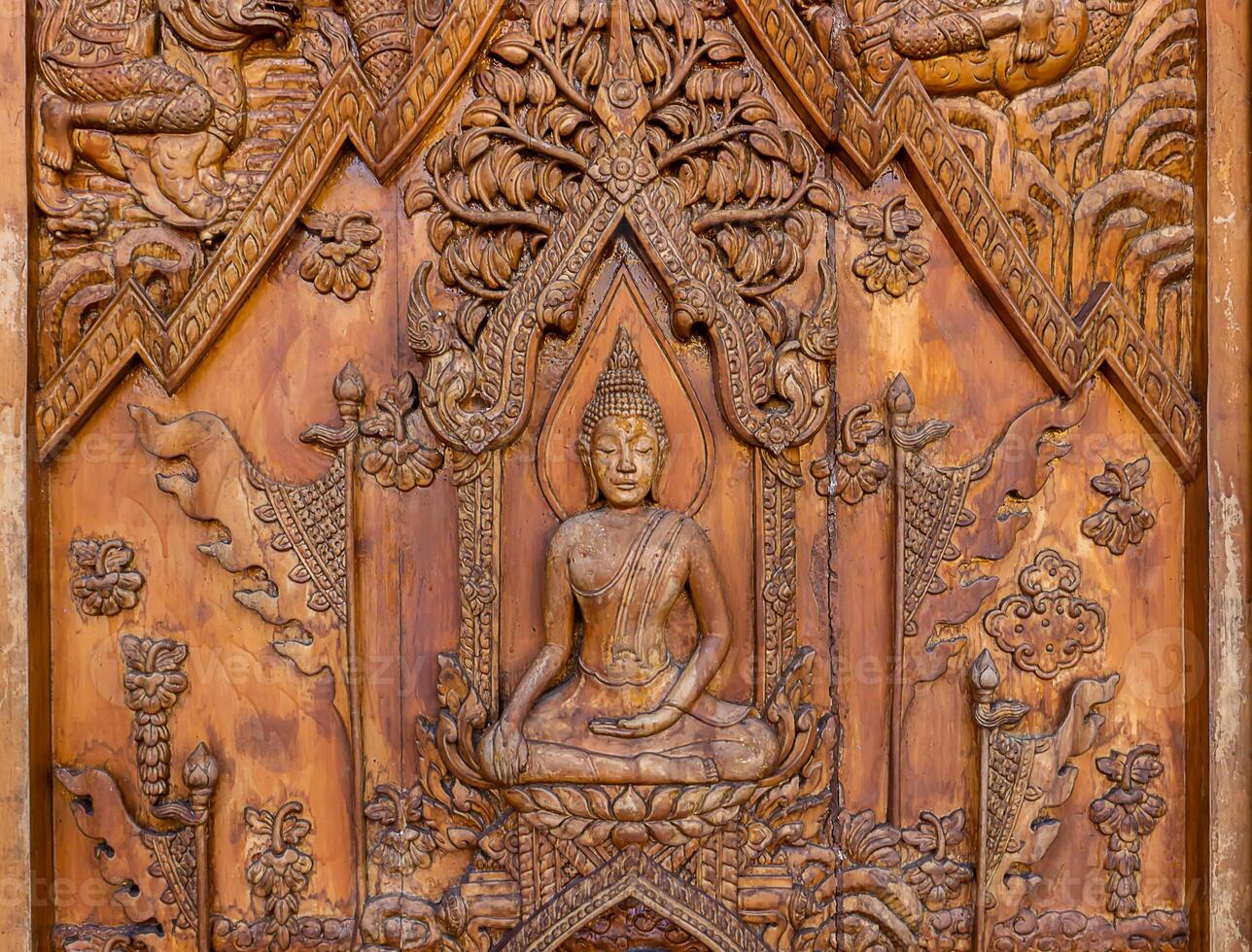 Wood carving of Buddhist history photo