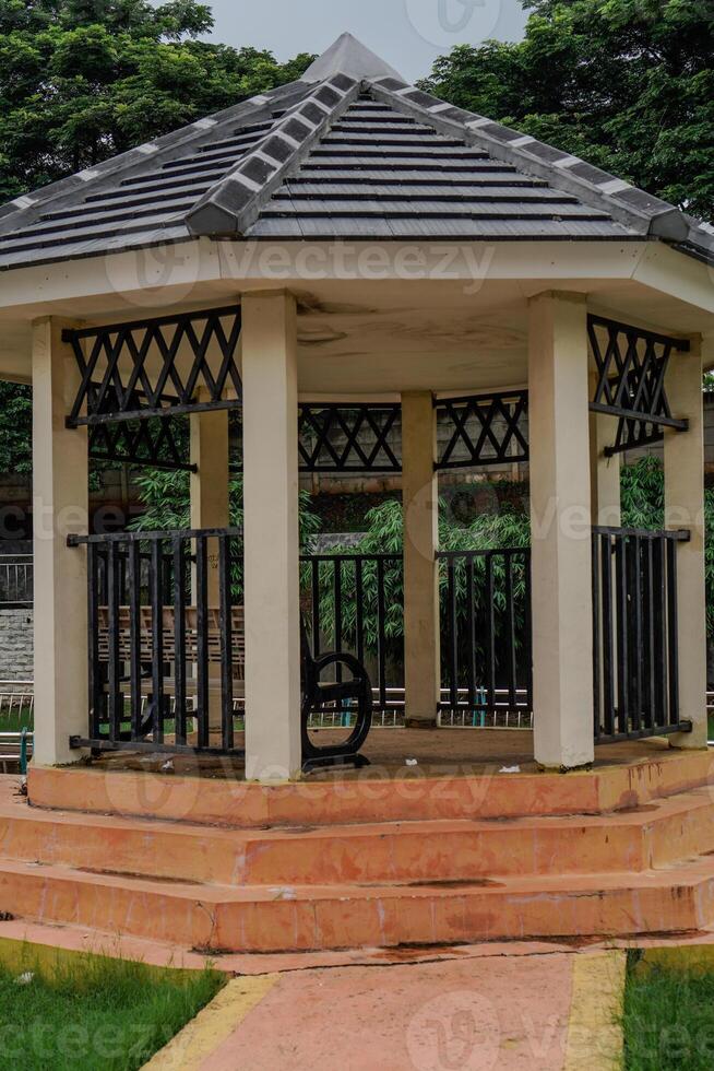 close-up view of permanent gazebo building in city park. photo
